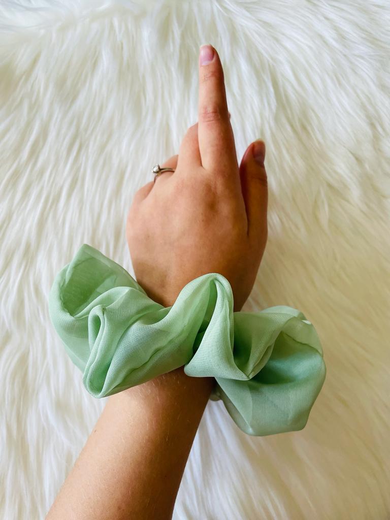 sage green oversized chiffon scrunchie on wrist | EMI & CO | KIA