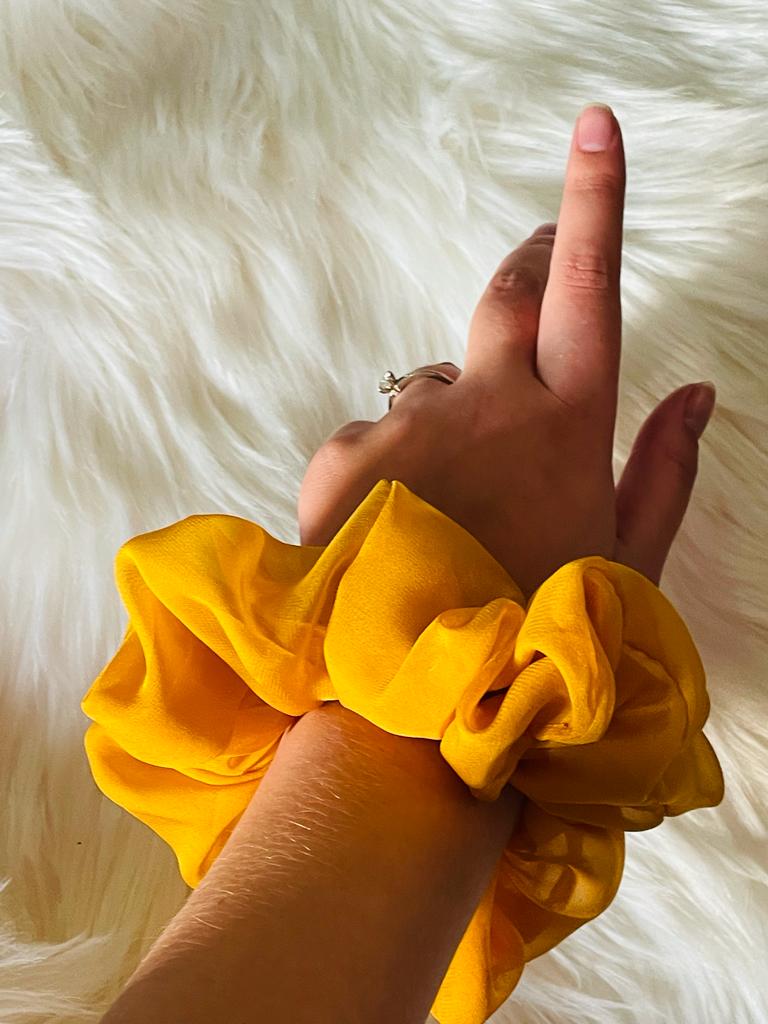 oversized yellow chiffon scrunchie on wrist  | EMI & CO | olivia 