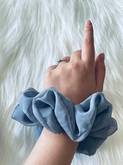 Oversized grey chiffon scrunchie on wrist 