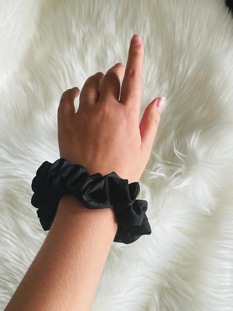 COMPASSIONATE | EMI & CO | mini black scrunchie on wrist 