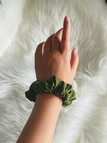 LOYAL | EMI & CO | mini olive green scrunchie on wrist