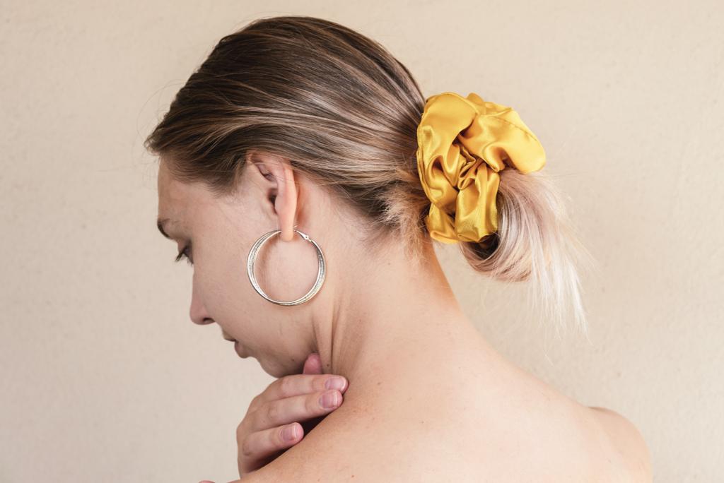 AUTUMN | EMI & CO | woman with a yellow satin messy bun 