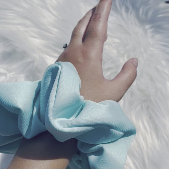 BIRDIE | EMI AND CO | blue neutral scrunchie on wrist 