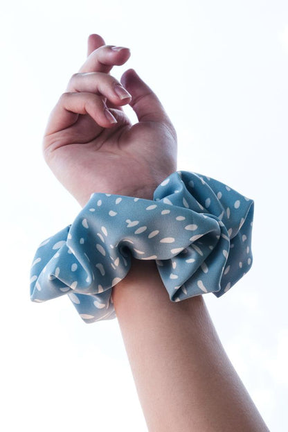 CLAIRE | EMI & CO | blue polka dot scrunchie on wrist 