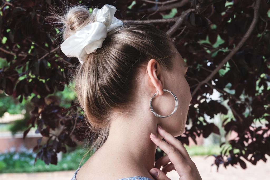 DESTINY |  EMI & CO | messy bun with white satin scrunchie