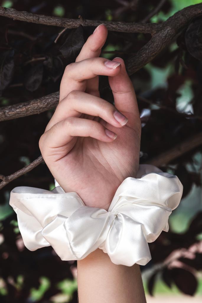 DESTINY | EMI & CO | white satin scrunchie on wrist