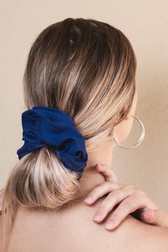 ELIZABETH | EMI & CO | low messy bun with a royal blue oversized scrunchie