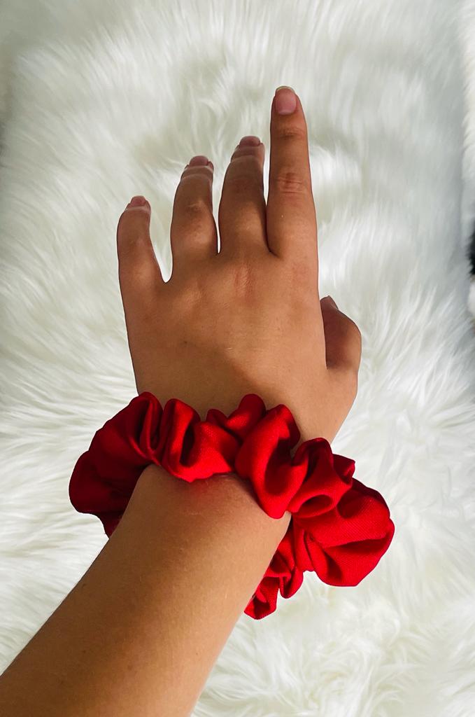 EMI & CO | JOY |  a red mini scrunchie on wrist