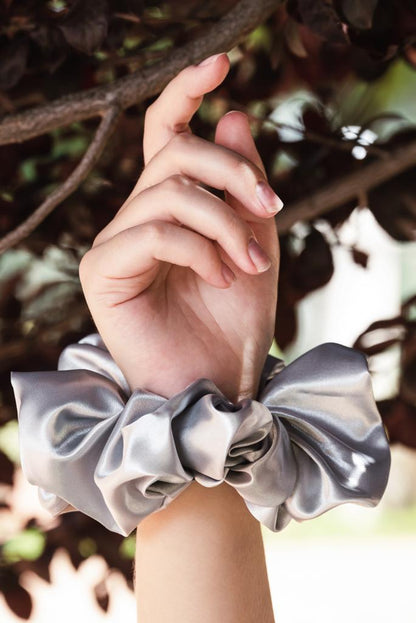 MARGARET | EMI & CO | oversize silver satin scrunchie on wrist