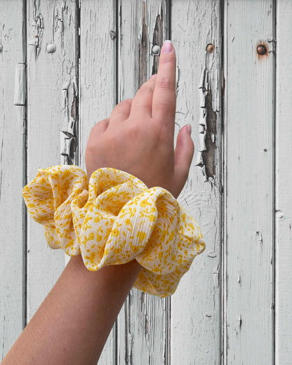 LENA | EMI & CO | oversized yellow floral scrunchie  on wrist 