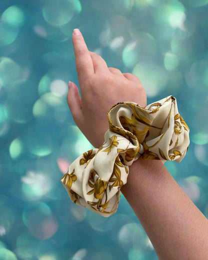 SUNNY | EMI & CO | oversize yellow floral scrunchie on wrist