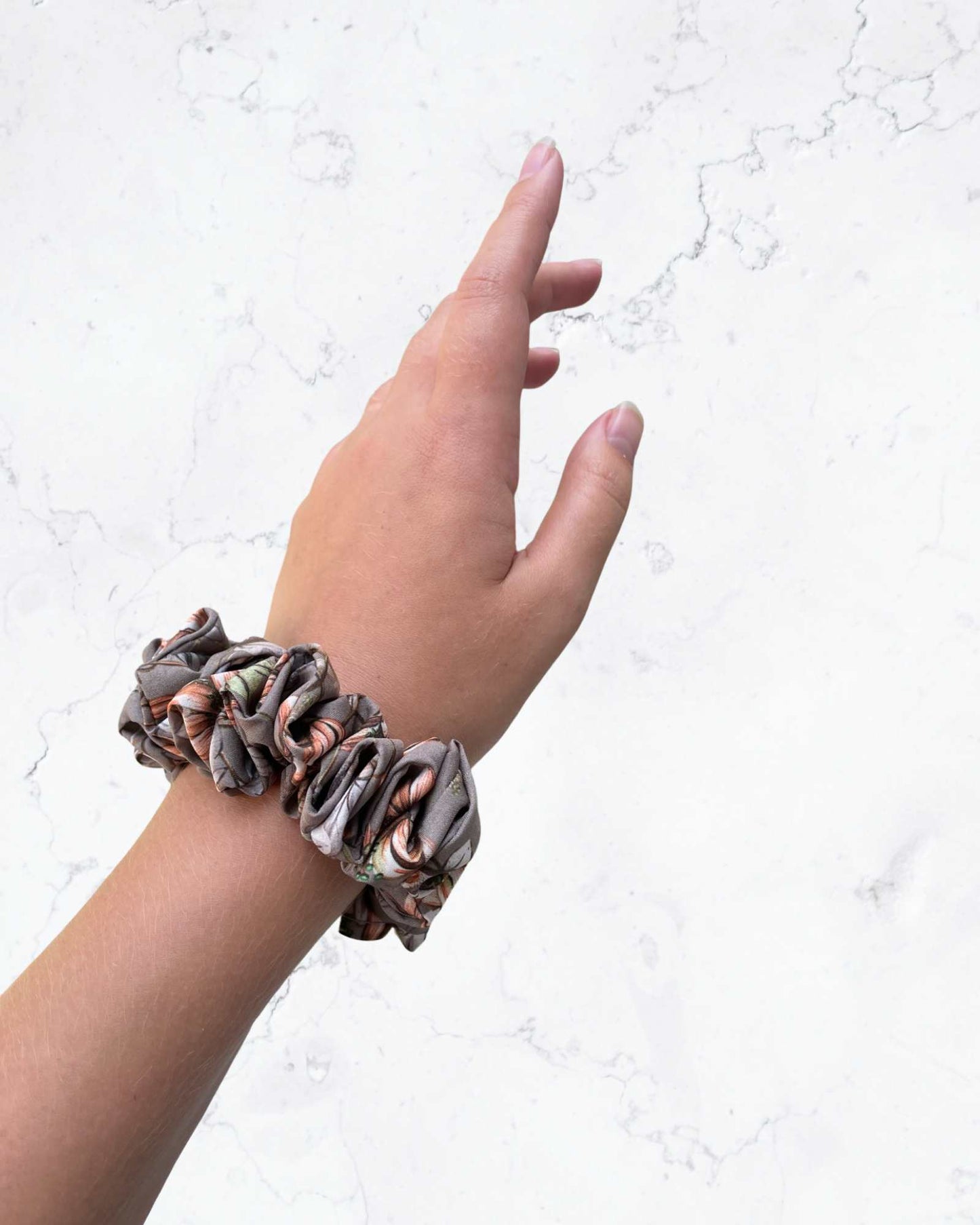 ZOE MINI | EMI & CO | mini floral brown scrunchie on wrist