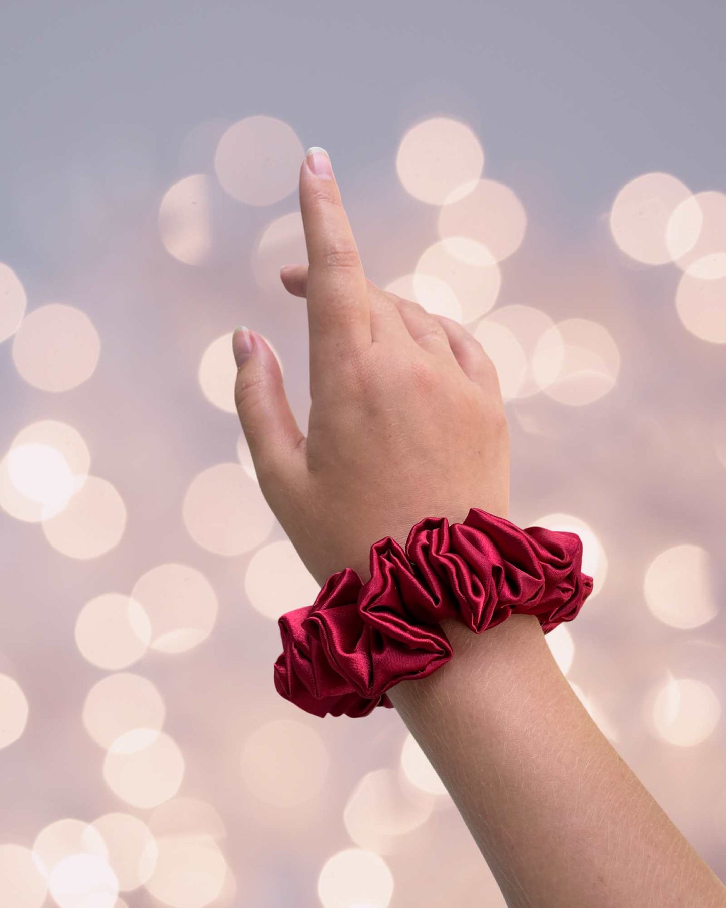 EMI & CO | ARIEL MINI | mini red satin scrunchie on wrist