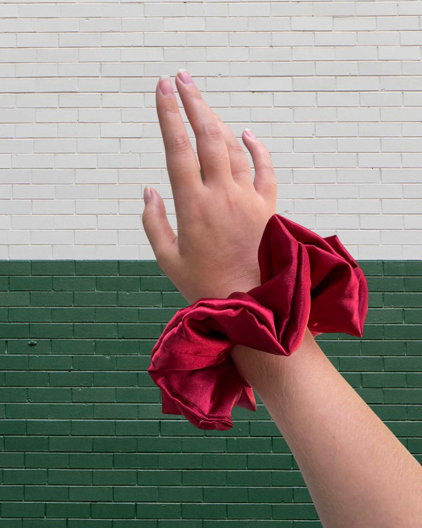 EMI & CO | ARIEL | Satin ruby red oversized scrunchie on wrist