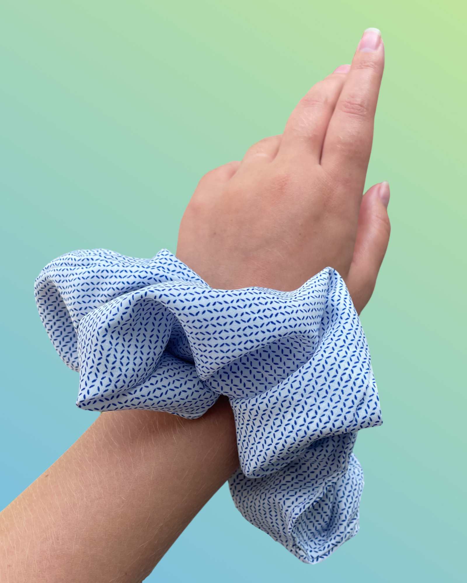 MILA | EMI & CO | patterned white and blue oversize scrunchie on wrist 